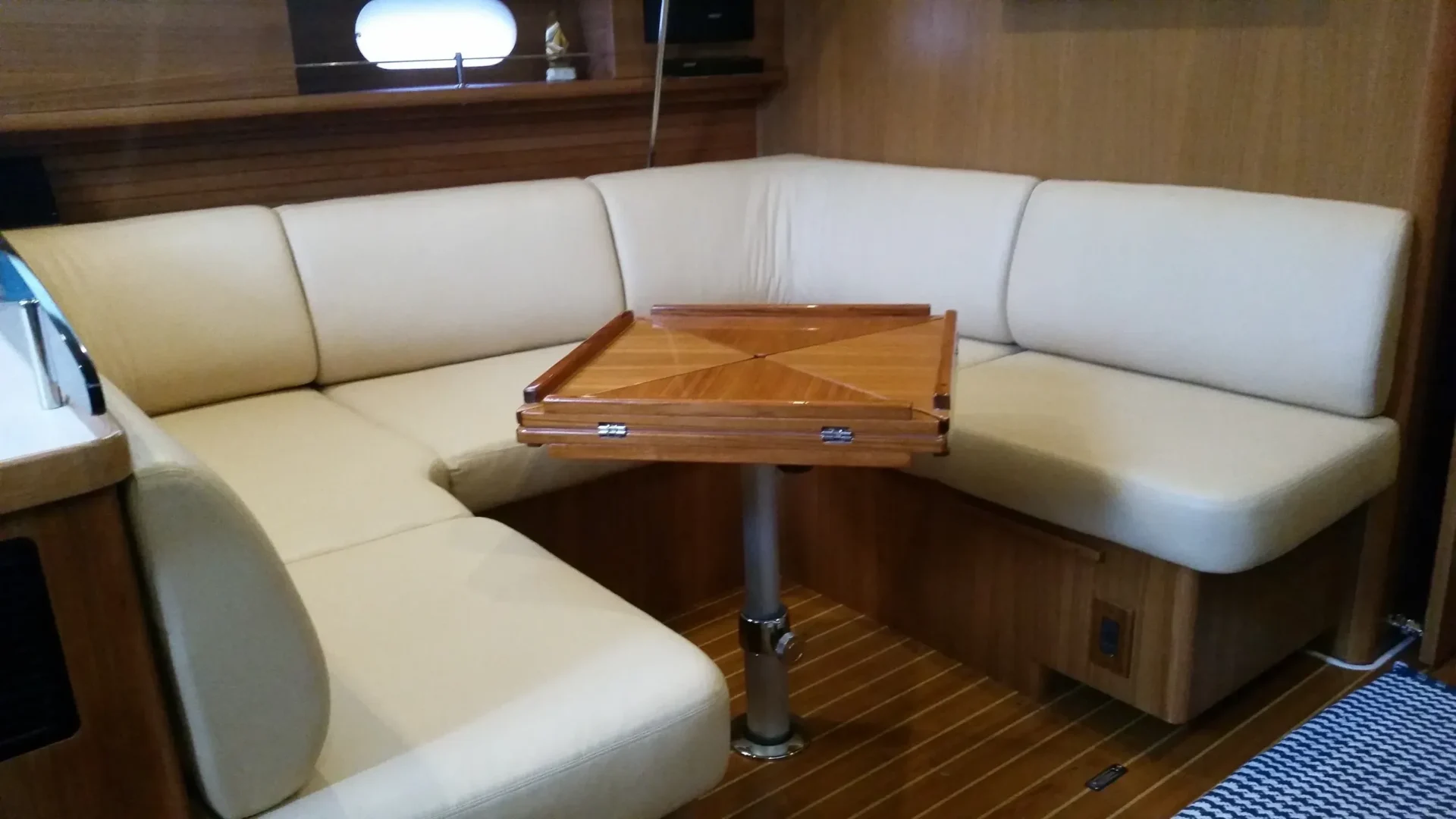 Boat interior with corner sofa and table