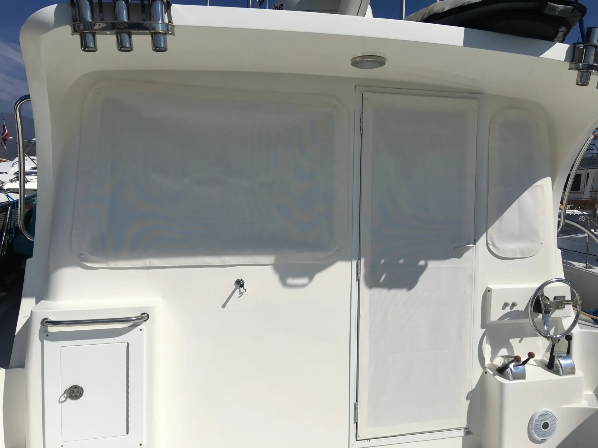 Sunlit boat deck with shadows